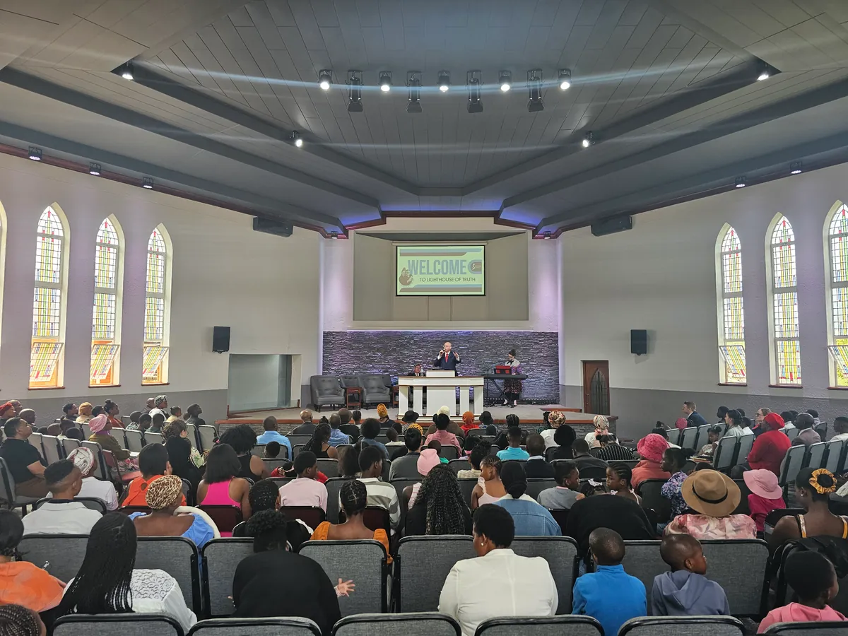 Congregation worshipping at Lighthouse of Truth Easter service.